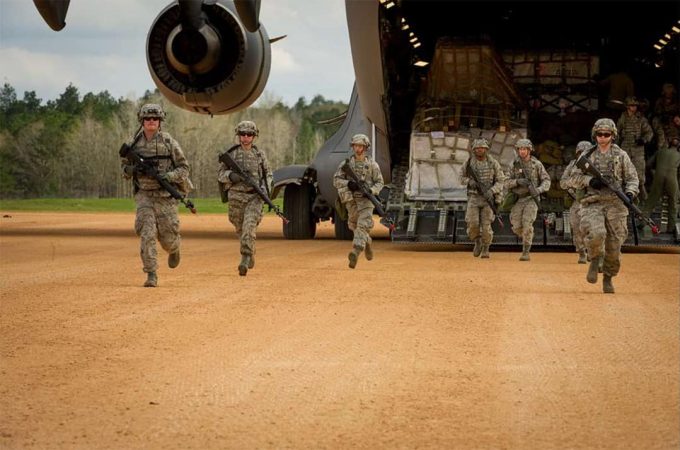 U.S. Air Force aeromedical evac unit in training deplanes to take up security positions around landing zone, 2014