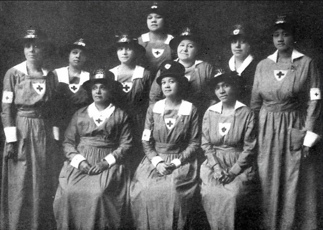 World War I Red Cross canteen workers attending troop trains transporting men of African descent, Chicago 1919