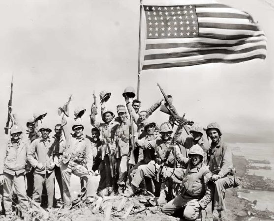 U.S. Marines summiting Mt. Suribachi during the Battle of Iwo Jima, February 23, 1945